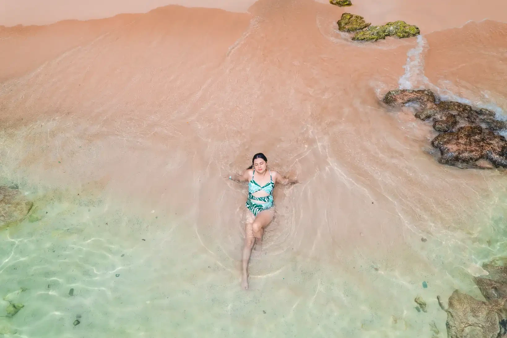 Person relaxing and enjoying Bahía Concha, Tayrona National Park, Colombia